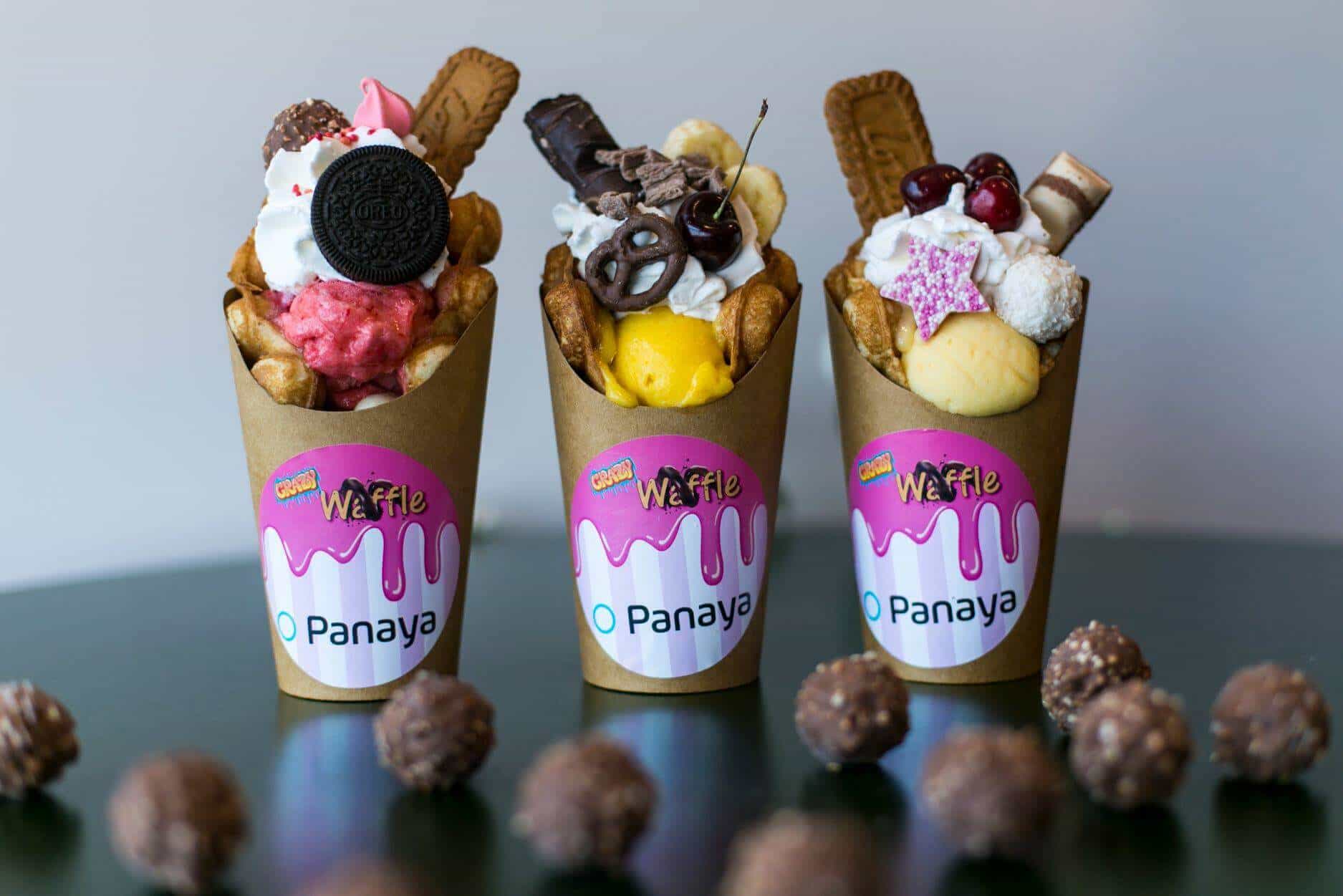 Showcasing Panaya office treats with branded snack cups and popular candy bars on display.